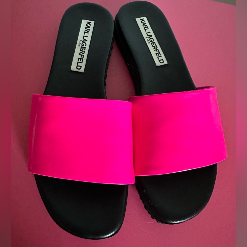 Karl Langford leather pink slides with shiny patent leather appearence.